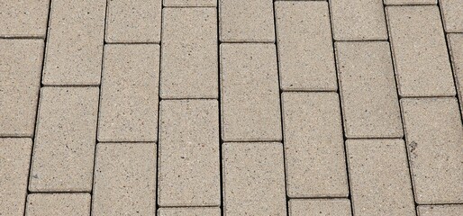 Sidewalk seamless pattern with dumb interlocking textured concrete tiles. Vector pavement texture...