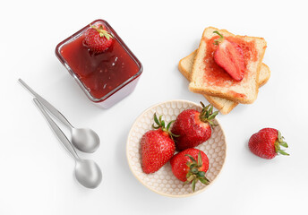 Tasty toasts with sweet strawberry jam and fresh berries on light background