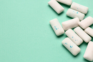 Fresh chewing gums on turquoise background
