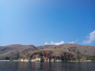 selective focus, natural view of an island against a clear sky.