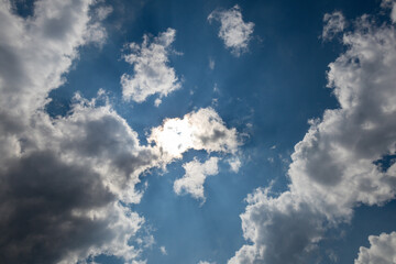 sky replacement blue sky with clouds and sun and rays 