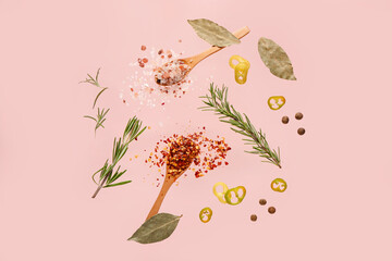 Flying spices and herbs on pink background