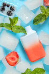 Electronic cigarette with berries and ice cubes on blue background