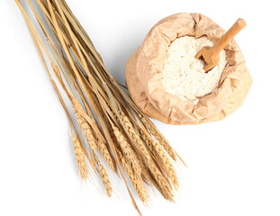 Paper bag with flour and wheat ears on white background