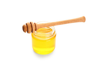 Jar of sweet honey and dipper on white background