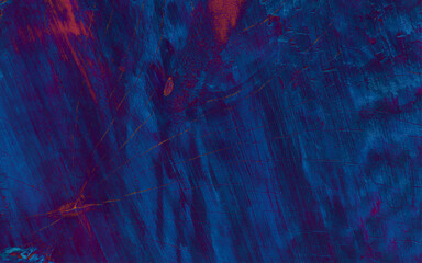 Dark blue textured wooden background with an aged look and with scratches and dents.