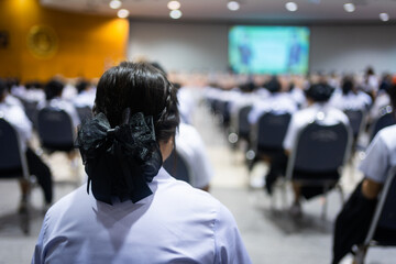 Adult students participating in a seminar in the conference hall