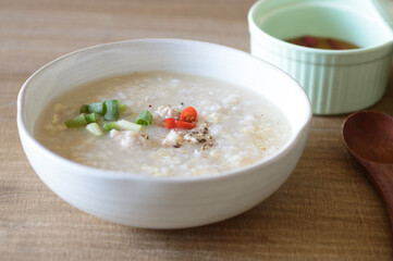 Chicken congee is comforting rice porridge with chicken and scallions.