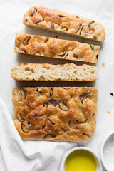 Top view of homemade onion focaccia on a white background, Flatlay of focaccia with red onion topping, fresh homemade focaccia bread
