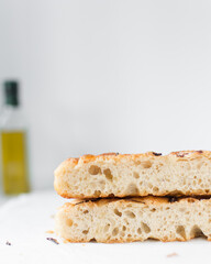 Cross section of focaccia on a white background, fresh homemade focaccia bread