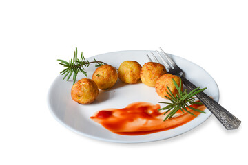 Tater tots with ketchup and rosemary .