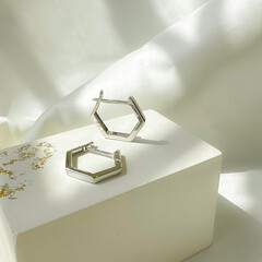 Stylish minimalism earrings in 14k white gold a on plaster mold.