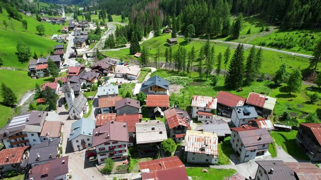 Flyover aerial of Sottoguda, most beautiful village in Italy. 4K Dolly out
