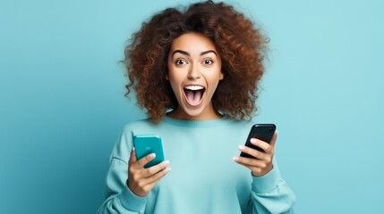 Fototapeta premium Happy Young Girl Making Win Gesture on Phone