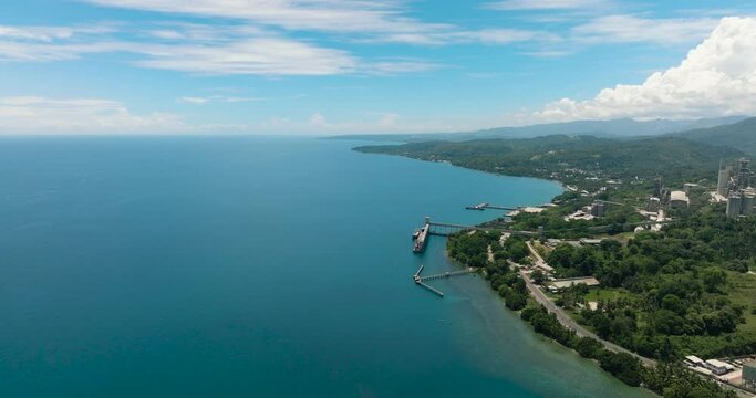 Cement plant and power station industrial building in coastal area. Lugait, Misamis Oriental. Mindanao, Philippines.