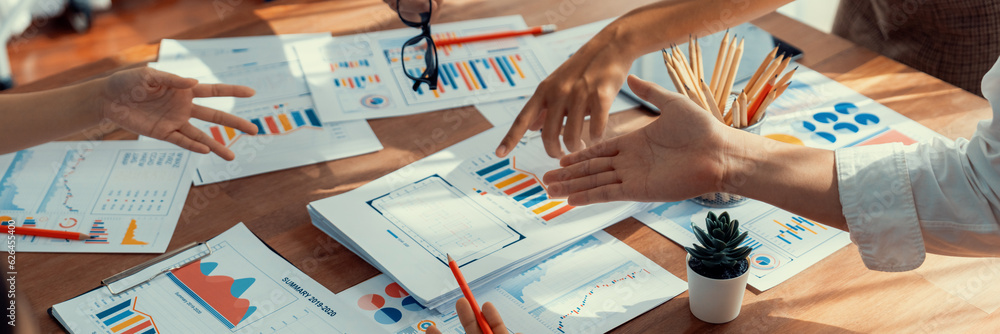 Poster analyst team utilizing bi fintech to analyze and pointing at financial dashboard paper office. busin