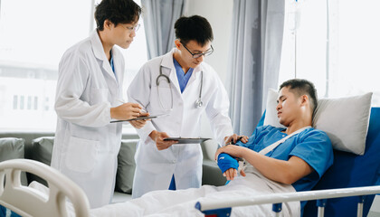 Hospital Ward Male and Femle Professional Asian Doctors Talk with a Patient, Give Health Care Advice, Recommend Treatment Plan  with Advanced Equipment .