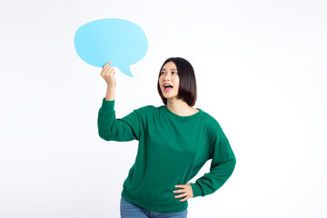 Portrait of asian young woman holding a empty blue speech bubble isolated on white background