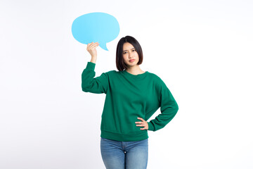 Portrait of asian young woman holding a empty blue speech bubble isolated on white background
