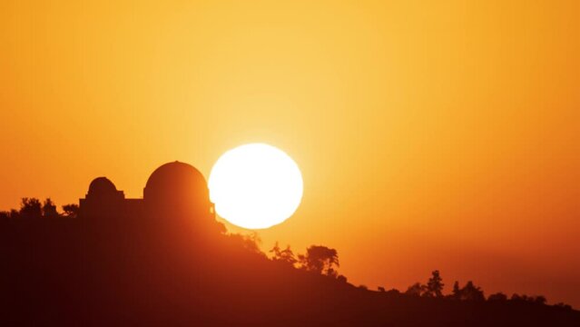 Time Lapse of the sun rising behind Griffith Observatory in Los Angeles.