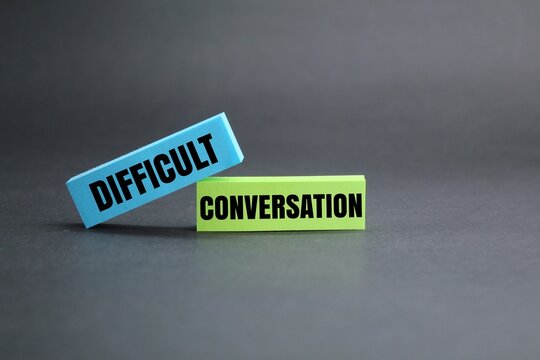colored paper with the word DIFFICULT CONVERSATION. difficult conversation concepts