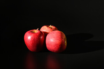 Fototapeta na wymiar Close-up of red apples isolated on black background