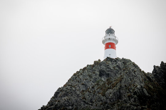 A lighthouse located at cape paliser in Wellington New Zealand. The location is extremely rockey and rugid
