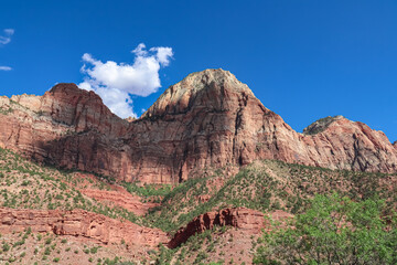 Scenic view of Navajo Sandstone mountain peak bridge mountain in Zion National Park, Washington County, Utah, United States, USA. Southwest aspect centered, viewed from Springdale. Uninhabited canyon