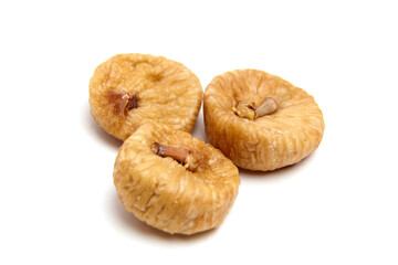 Dried fig fruits isolated on white. Three sweet sundried figs