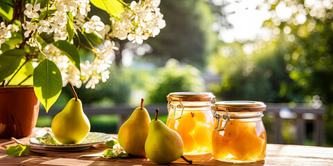 Close-up of pear jam and fresh pear in jars on the table against the backdrop of a natural bright garden
