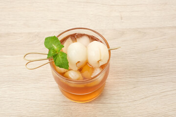 Lychee iced tea with mint leaves
