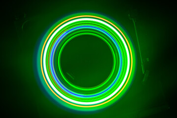 Music Dj concept. Trail of fire and smoke on vinyl record. Burning vinyl disk. Turntable vinyl record play Selective focus