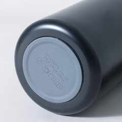 metal thermal bottle for water on a pastel background. Stainless Steel Vacuum Insulated thermos Bottle, Hero product shot of stainless steel reusable insulated beverage container