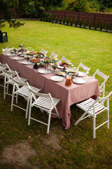 beautiful table setting with flowers and snacks at wedding reception. wedding decorations