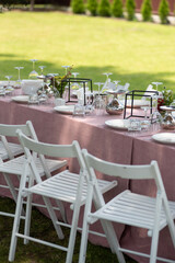 beautiful table setting with flowers and snacks at wedding reception. wedding decorations
