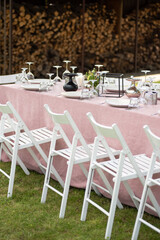beautiful table setting with flowers and snacks at wedding reception. wedding decorations