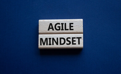 Agile Mindset symbol. Wooden blocks with words Agile MindsetAgile Mindset. Beautiful deep blue background. Business and Agile Mindset concept. Copy space.