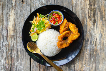 Deep fried red tilapia with papaya salad, Thai traditional food