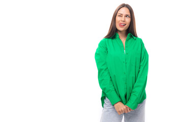 positive slim european young brunette woman with makeup in green shirt on white background with copy space