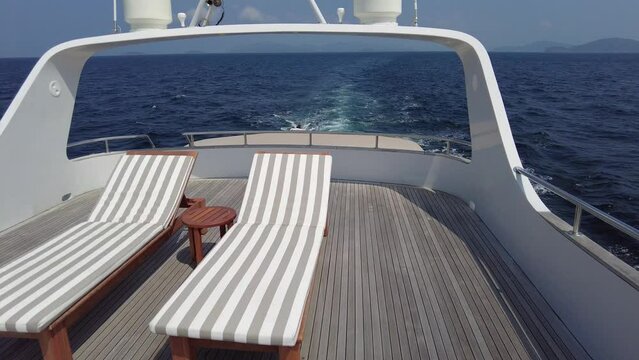 Sun loungers on the upper deck of a motor yacht, interior details of a private luxury motor yacht