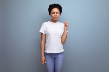 pretty young brunette hispanic woman in white t-shirt isolated with copy space background