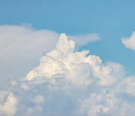 white clouds in the blue sky.