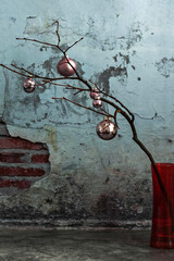 Christmas balls on dry tree branches, which stand in a vase against the background of an old vintage brick wall with cracked plaster on the background of the texture of plaster. retro Grunge.