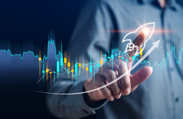 Businessman touch rocket launch investment growth, planning and starting corporate business start...