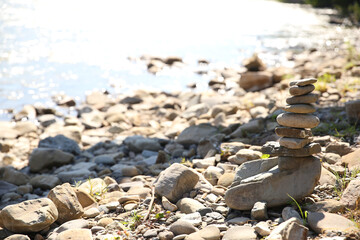 mountain river, stone tower on the river, rocky shore, fast river in the mountains


