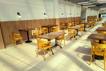 The interior of an empty cafe in sunlight