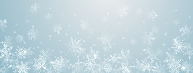 Christmas background of beautiful complex big and small snowflakes in light blue colors. Winter illustration with falling snow