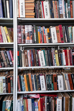12.07.2023, Kemerovo, Russia. There are a lot of books on the shelves in the school library. Not new, old books in the public library. Background from books