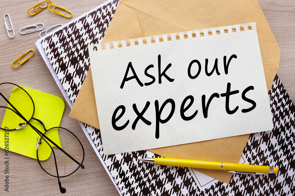 Poster ask our expert top view of a torn page on an envelope.word on the page