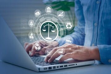 Businessman typing computer with environmental law icon on virtual screen. Concept. Global environmental law and world industry. respect for environmental laws, etc.